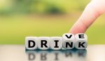 Drink or drive? Hand turns dice and changes the word 